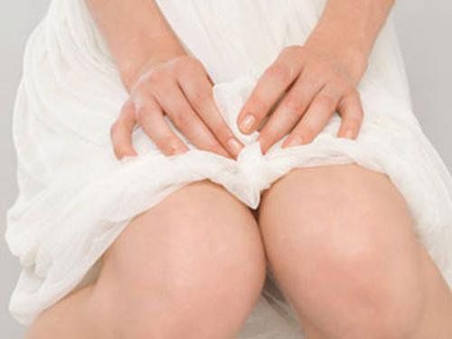 What should I do if I have excessive vaginal discharge, discomfort from moisture, irregular menstrual cycles, and polycystic ovary syndrome?