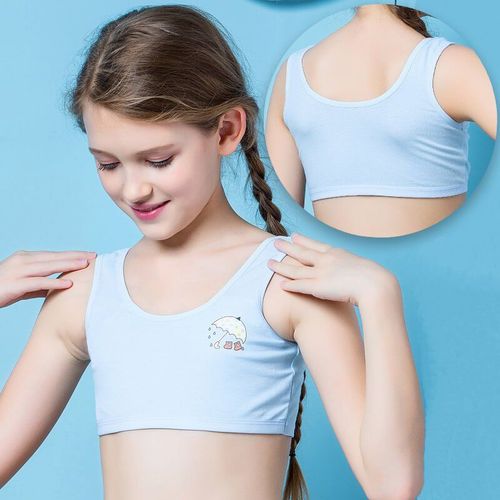 How do girls' breasts develop during puberty?